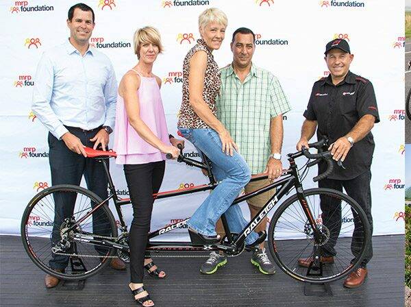 Pietermaritzburg cyclist, Tessa Hesse, wins a Raleigh 'Duo' Tandem bicycle for raising the most funds in the Ride for MRP Foundation.