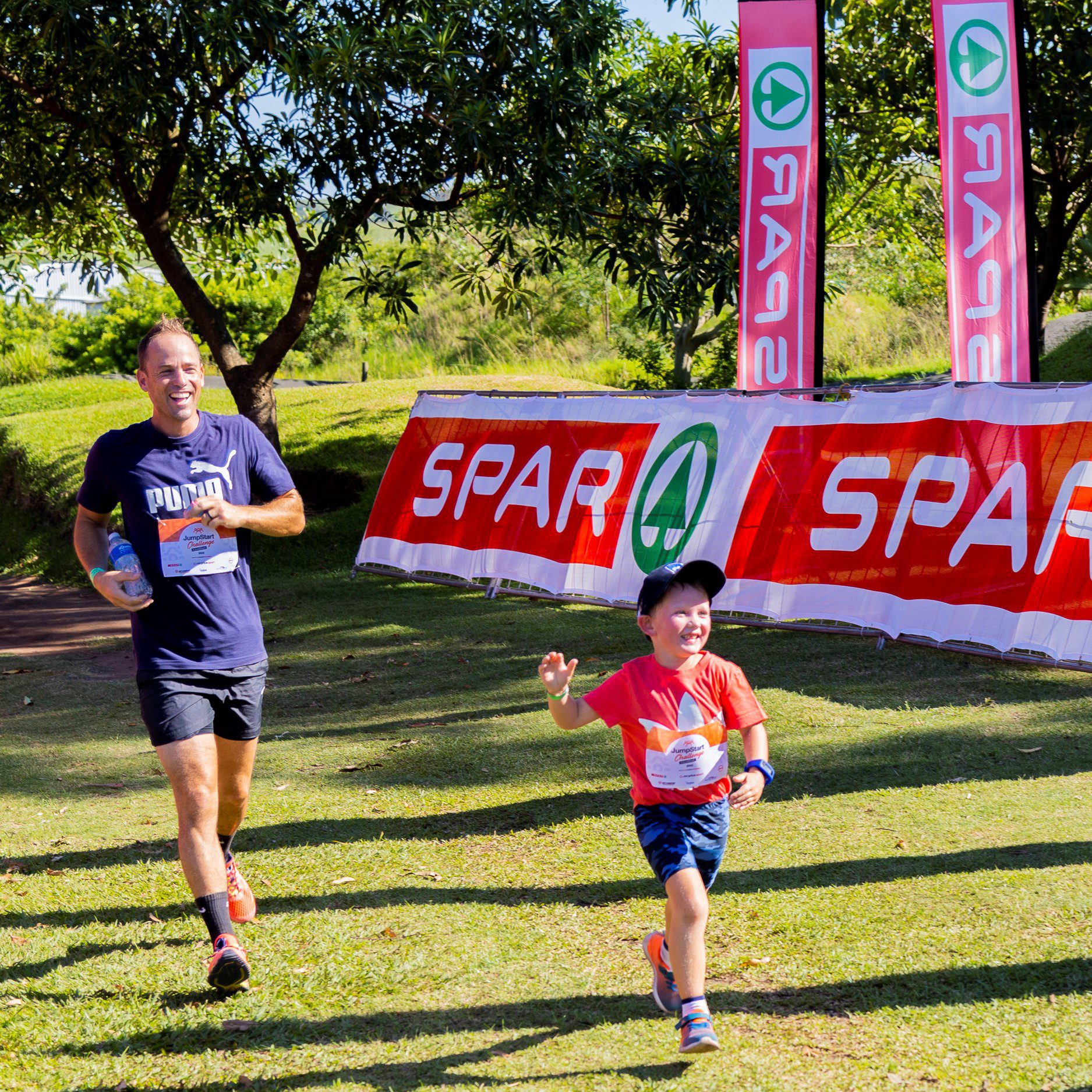 father and son running square